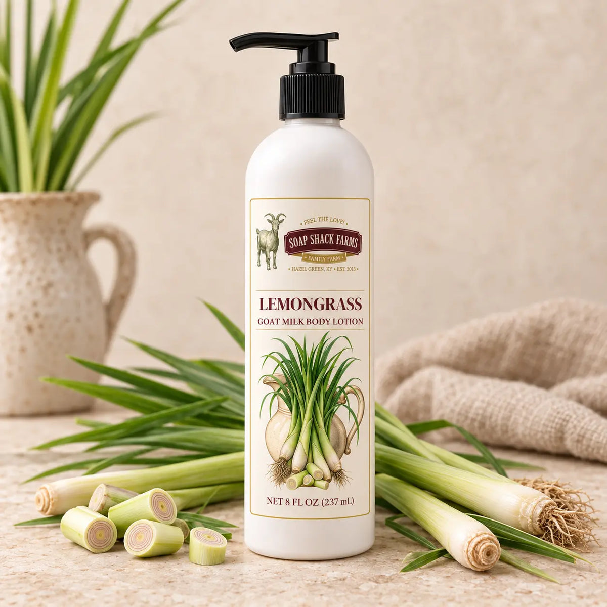 Lemongrass Goat Milk Body Lotion in an 8 oz pump bottle displayed with fresh lemongrass stalks