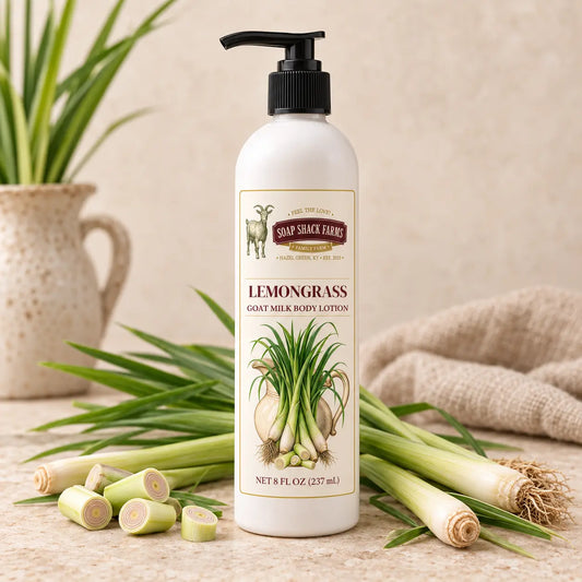 Lemongrass Goat Milk Body Lotion in an 8 oz pump bottle displayed with fresh lemongrass stalks