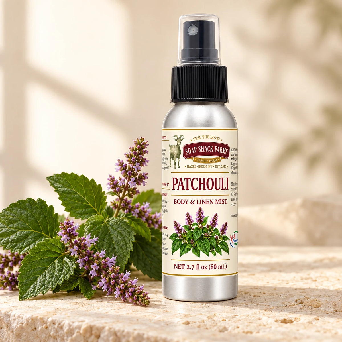 Soap Shack Farms Patchouli body and linen mist in a warm botanical studio setting.