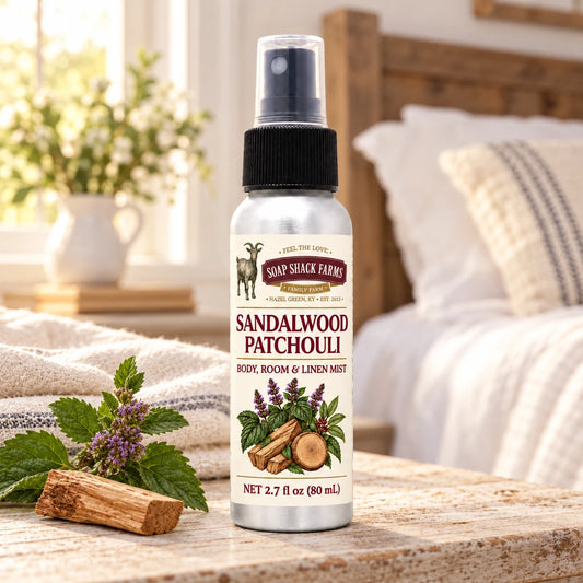Soap Shack Farms Sandalwood Patchouli mist beside linen, sandalwood and patchouli in a bright farmhouse bedroom.