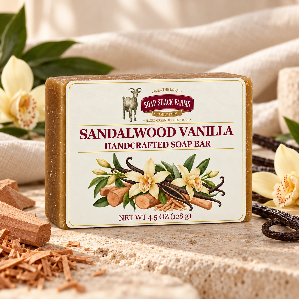 Sandalwood Vanilla olive oil soap bar on cream stone with sandalwood, vanilla beans, orchids, and soft linen.