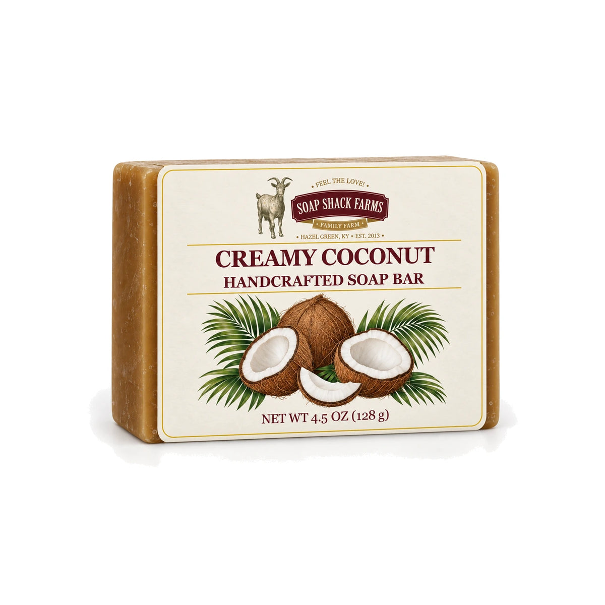 Creamy Coconut handcrafted olive oil soap bar with coconut and palm botanical label on a white background.