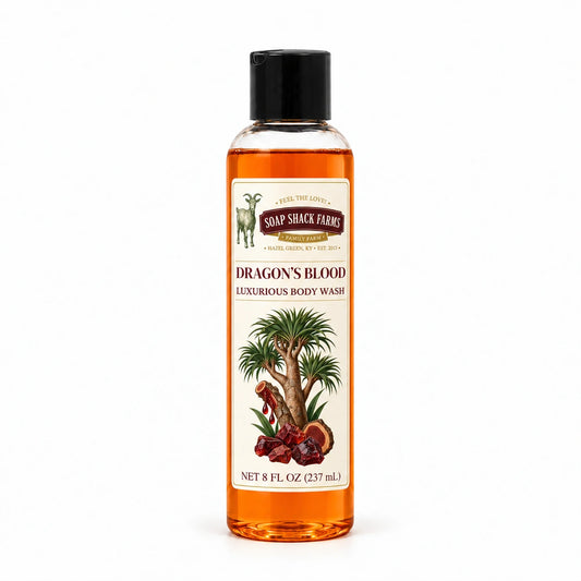 Dragons Blood luxurious body wash in a slender clear 8 oz bottle with a black disc-top cap on a white background.