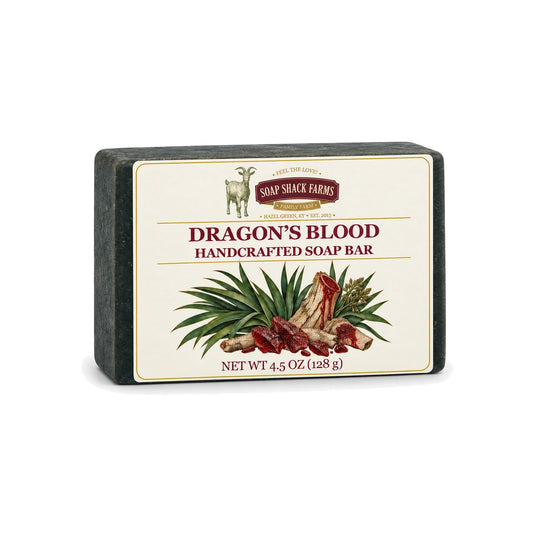 Dragon’s Blood handcrafted olive oil soap bar with botanical resin label on a white background.