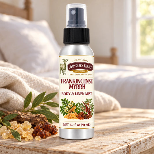 Soap Shack Farms Frankincense Myrrh body and linen mist on a farmhouse bedside table with natural botanicals and linen.