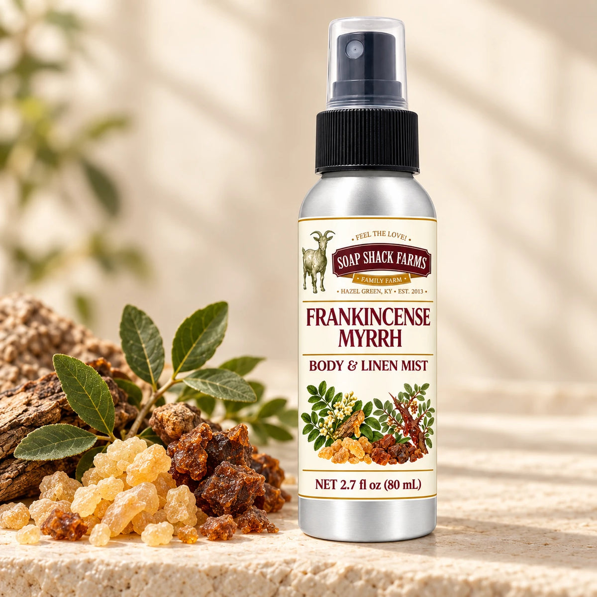 Soap Shack Farms Frankincense Myrrh body and linen mist in a warm botanical studio setting.