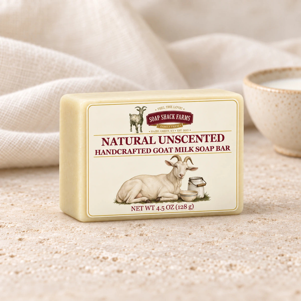 Natural Unscented goat milk soap bar with soft cream linen and a stoneware bowl of milk.