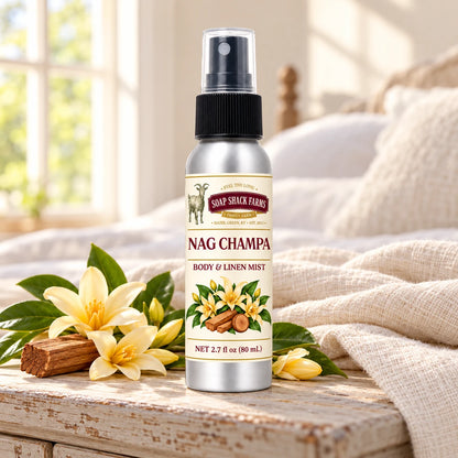 Soap Shack Farms Nag Champa body and linen mist on a farmhouse bedside table with natural botanicals and linen.