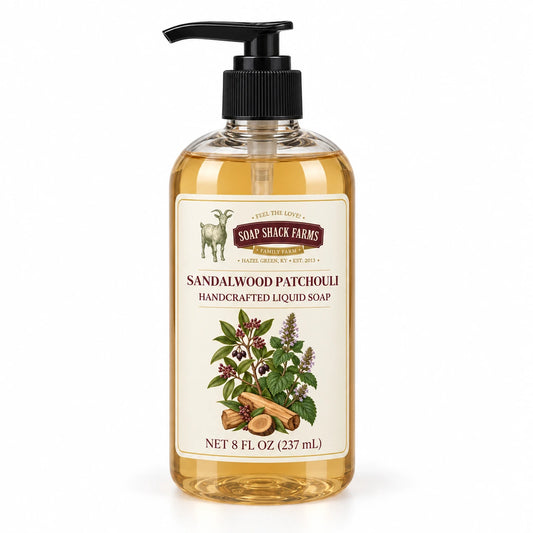 Sandalwood Patchouli handcrafted liquid soap in a clear 8 oz pump bottle on a white background.