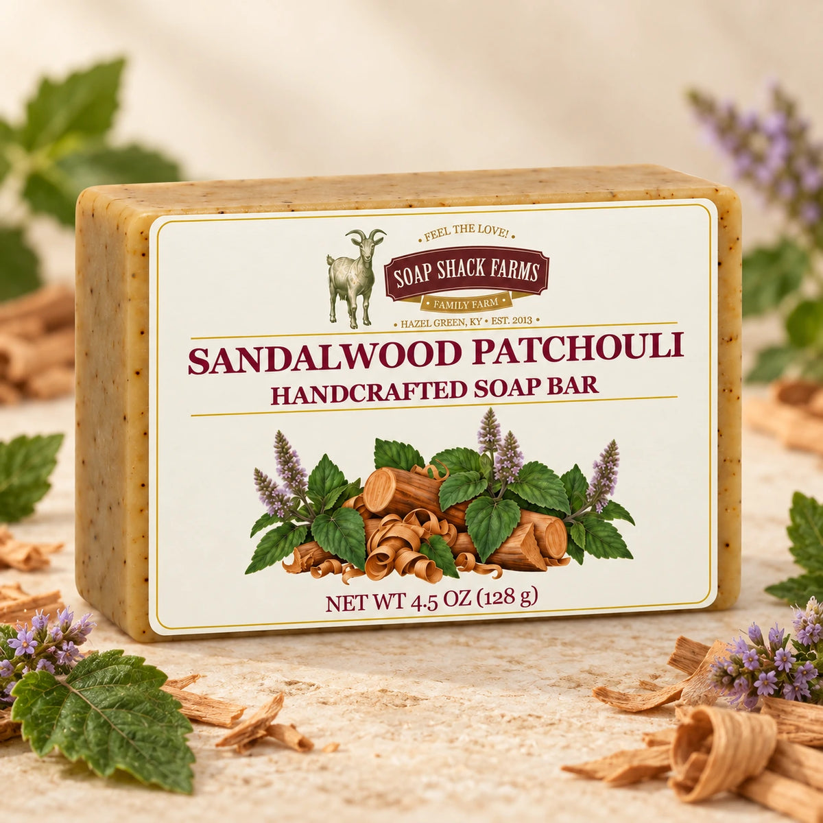 Sandalwood Patchouli olive oil soap bar on cream stone with patchouli flowers and wood shavings.