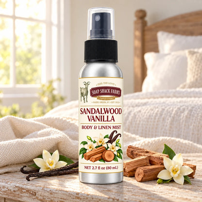Soap Shack Farms Sandalwood Vanilla body and linen mist on a farmhouse bedside table with natural botanicals and linen.