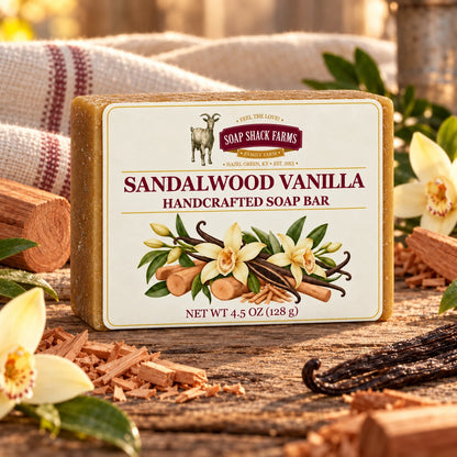 Sandalwood Vanilla olive oil soap bar on rustic wood with sandalwood shavings, vanilla beans, orchids, and farmhouse linen.