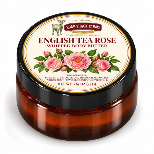 Soap Shack Farms English Tea Rose Whipped Body Butter in a closed amber jar with a labeled black lid on white.