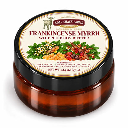 Closed amber jar of Soap Shack Farms Frankincense Myrrh Whipped Body Butter with a black lid and cream botanical label on white.