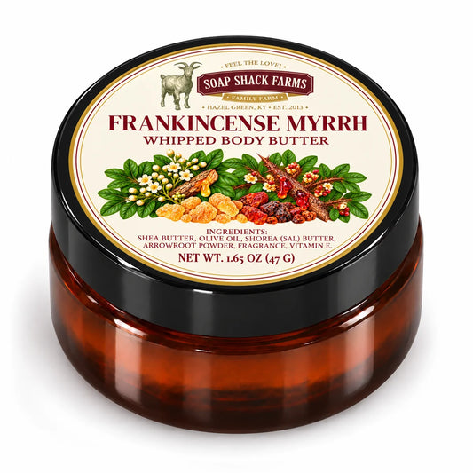 Closed amber jar of Soap Shack Farms Frankincense Myrrh Whipped Body Butter with a black lid and cream botanical label on white.