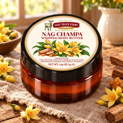 Soap Shack Farms Nag Champa Whipped Body Butter in an amber jar on rustic wood and linen in a warmly lit farmhouse setting.