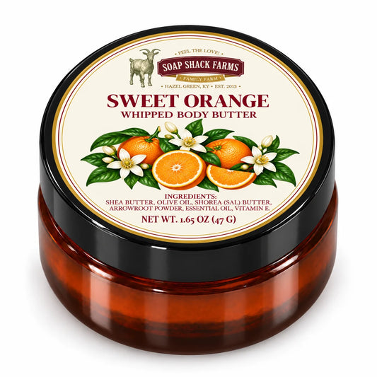 Soap Shack Farms Sweet Orange Whipped Body Butter in a closed amber jar with a labeled black lid on white.