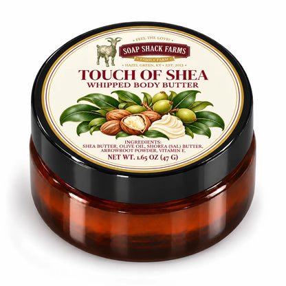 Soap Shack Farms Touch of Shea Whipped Body Butter in a closed amber jar with a labeled black lid on white.