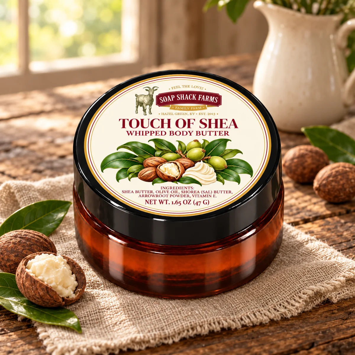 Soap Shack Farms Touch of Shea Whipped Body Butter in an amber jar on rustic wood and linen in a warmly lit farmhouse setting.