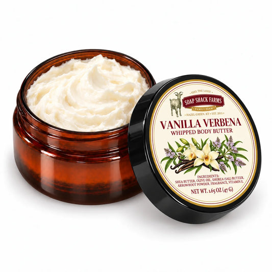 Soap Shack Farms Vanilla Verbena Whipped Body Butter in an open amber jar showing ivory whipped texture beside its labeled black lid.