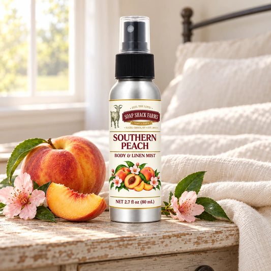 Soap Shack Farms Southern Peach body and linen mist on a farmhouse bedside table with natural botanicals and linen.