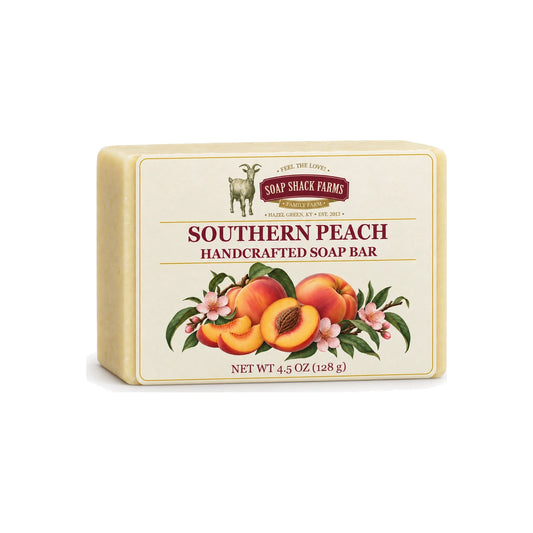 Southern Peach handcrafted olive oil soap bar with peach botanical label on a white background.
