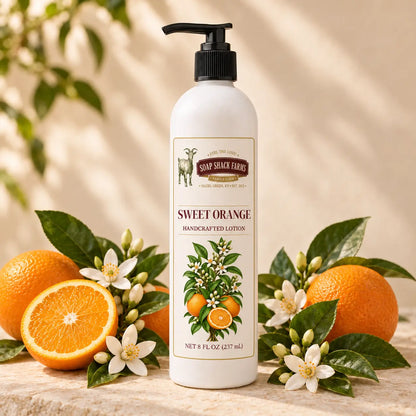 Soap Shack Farms Sweet Orange Handcrafted Body Lotion surrounded by ripe oranges, orange blossoms, and glossy green leaves