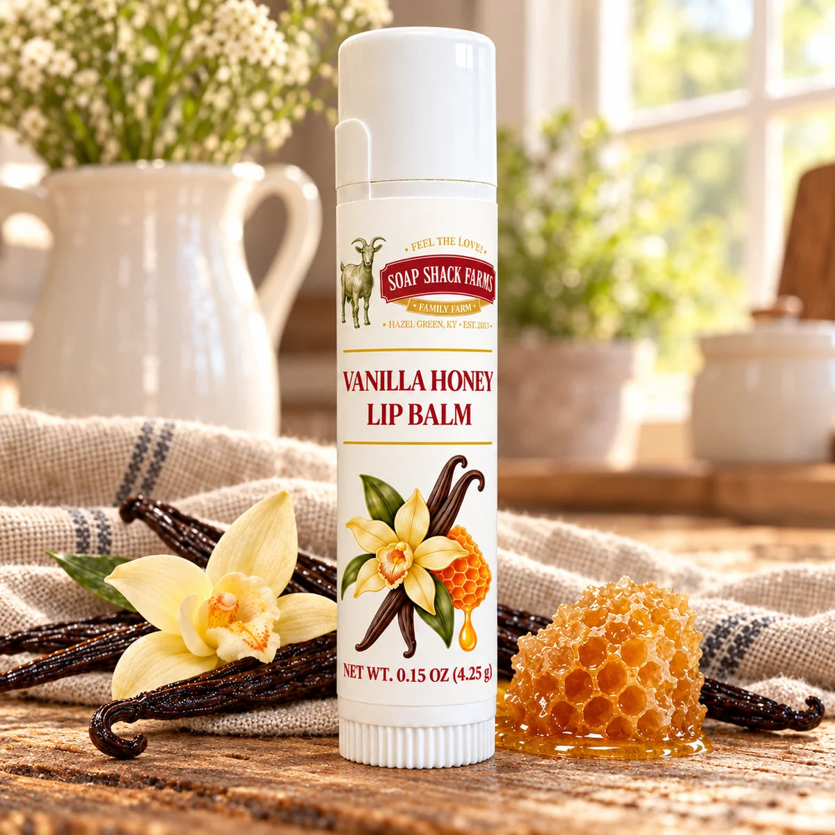 Soap Shack Farms Cucumber Melon Lip Balm in a white 0.15 oz tube on a rustic wooden table with linen in a sunlit farmhouse setting.