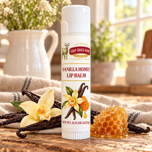 Soap Shack Farms Cucumber Melon Lip Balm in a white 0.15 oz tube on a rustic wooden table with linen in a sunlit farmhouse setting.