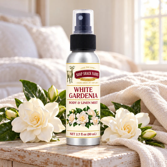 Soap Shack Farms White Gardenia body and linen mist on a farmhouse bedside table with natural gardenia blossoms and linen.